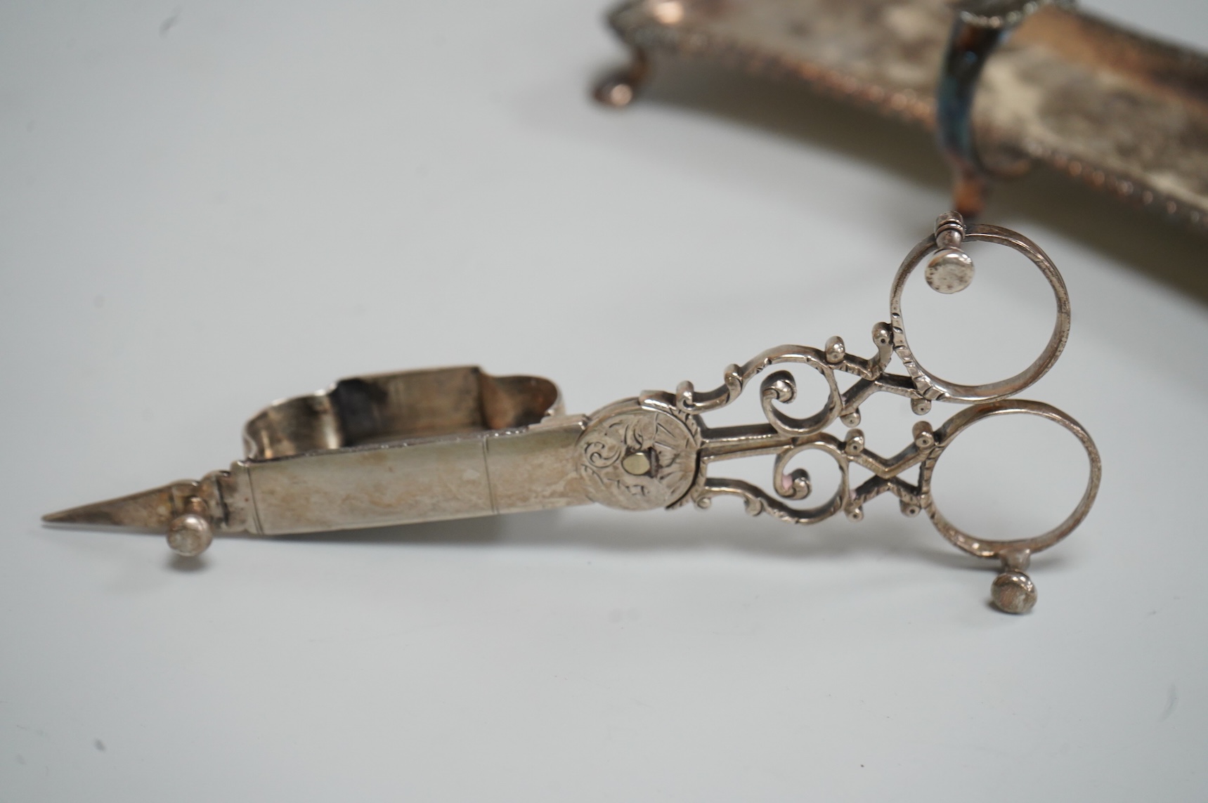 A pair late George II silver candle snuffers and similar stand, stand WC?, London, 1769, 18.5cm, snuffers I.B, London, 1769, 9oz.